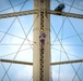 Going up: Airmen climb water tower