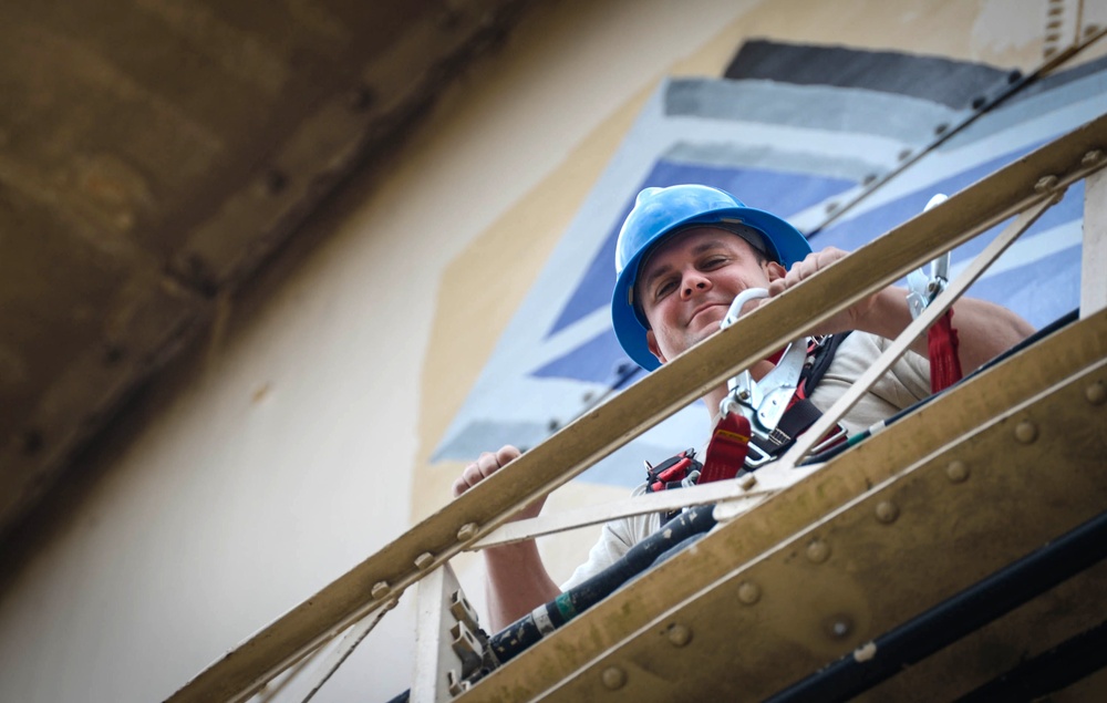 Going up: Airmen climb water tower