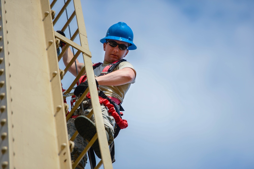 Going up: Airmen climb water tower