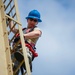 Going up: Airmen climb water tower