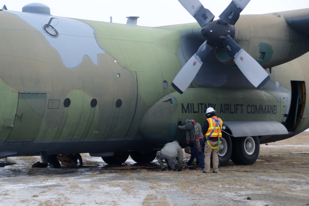 JBER tows static C-130 for restoration