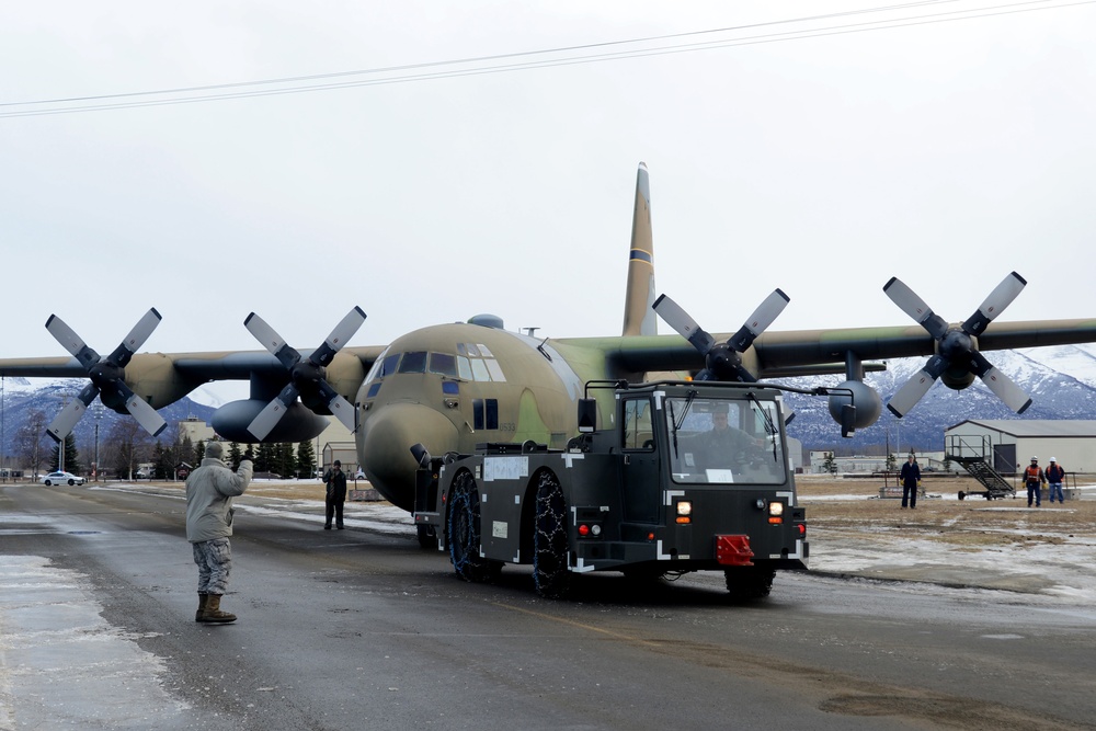 JBER tows static C-130 for restoration