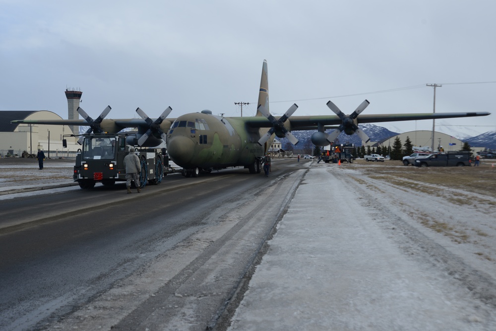 JBER tows static C-130 for restoration