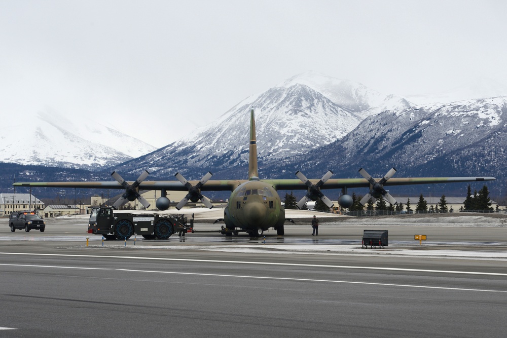 JBER tows static C-130 for restoration