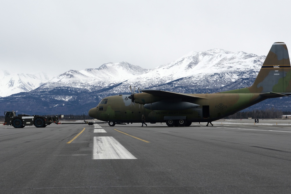 JBER tows static C-130 for restoration