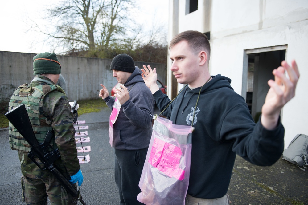 US Airmen role-play in a Special Operations Forces Training