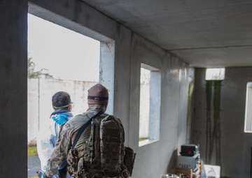 US Airmen role-play in a Special Operations Forces Training