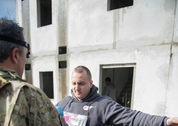 US Airmen role-play in a Special Operations Forces Training