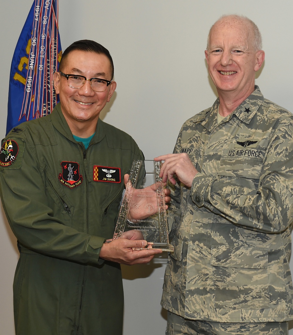 US Air Force BG Christopher Knapp gives Col. Jim Duong and CMSgt Kris Rode the 2015 ANG Medical Service Annual Award for Outstanding Achievement in Innovation.  (U.S. Air National Guard photo by Staff Sgt. Matthew T. Doyle/Released)