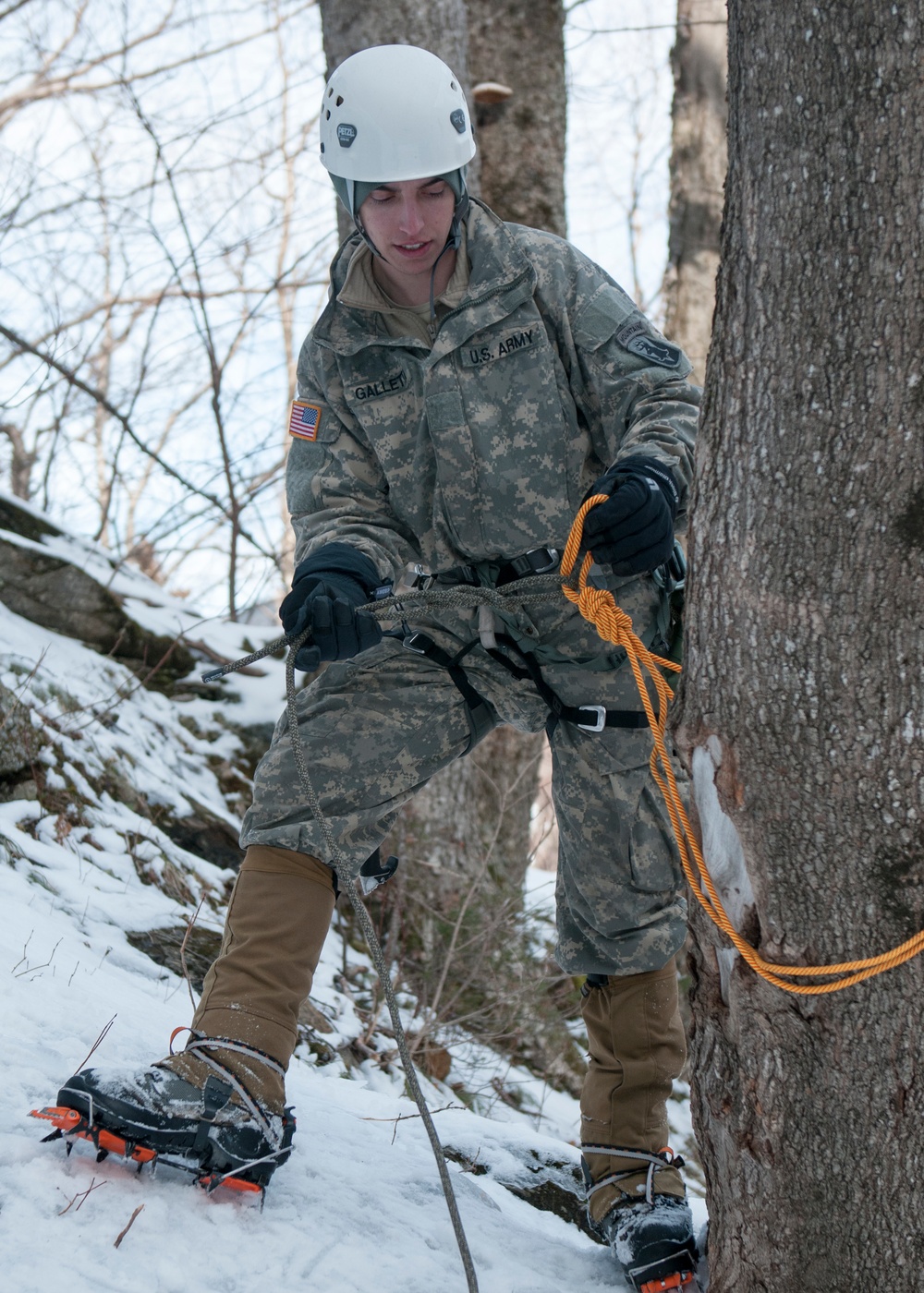 Vermont National Guard Soldier secures a rope for climbing