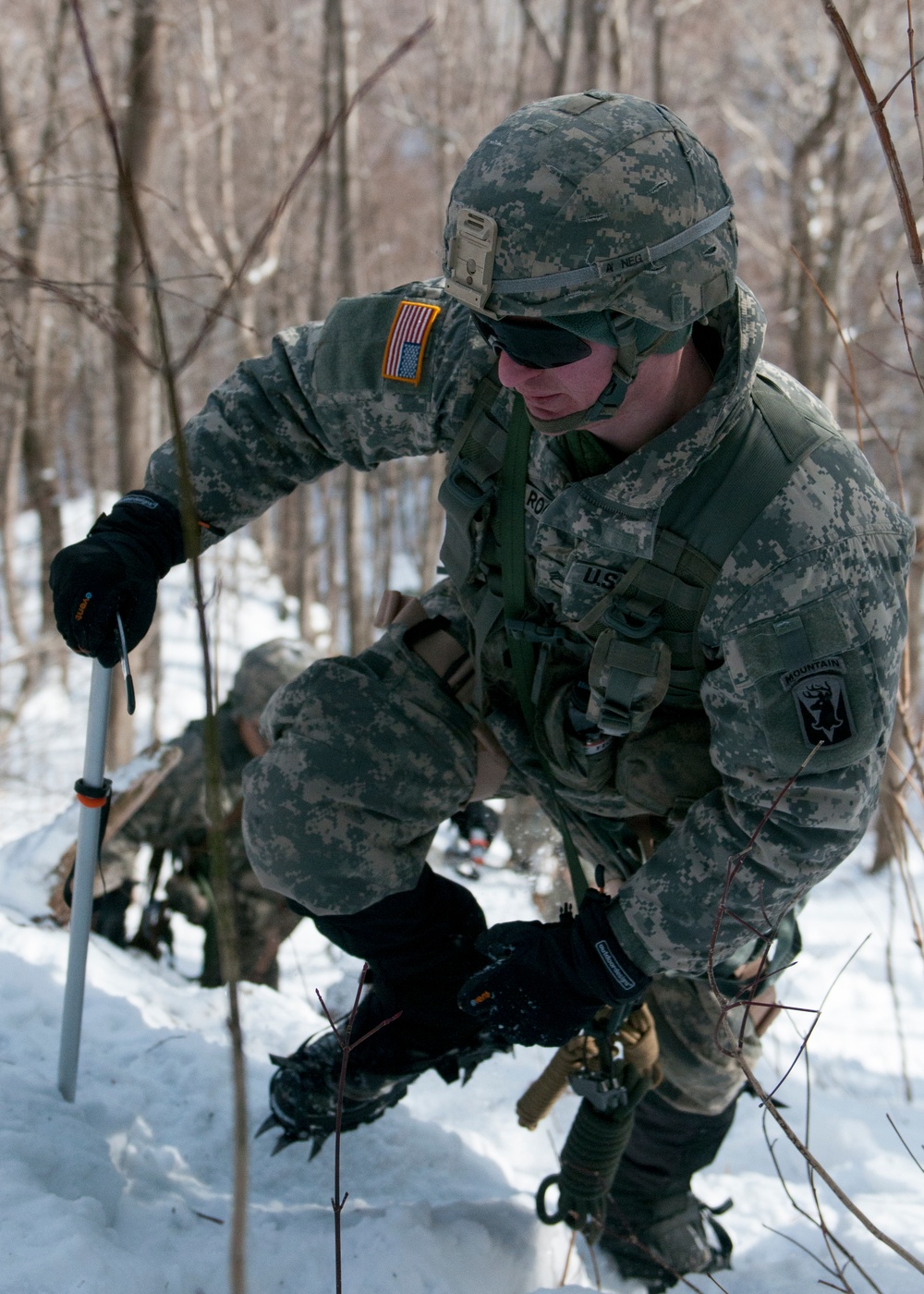 Vermont National Guard Soldier ascends a mountain