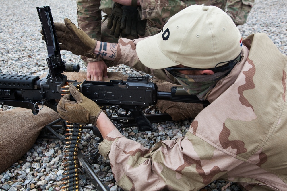 Dutch, Italian and German soldiers learn to assemble, disassemble, and operate the M240