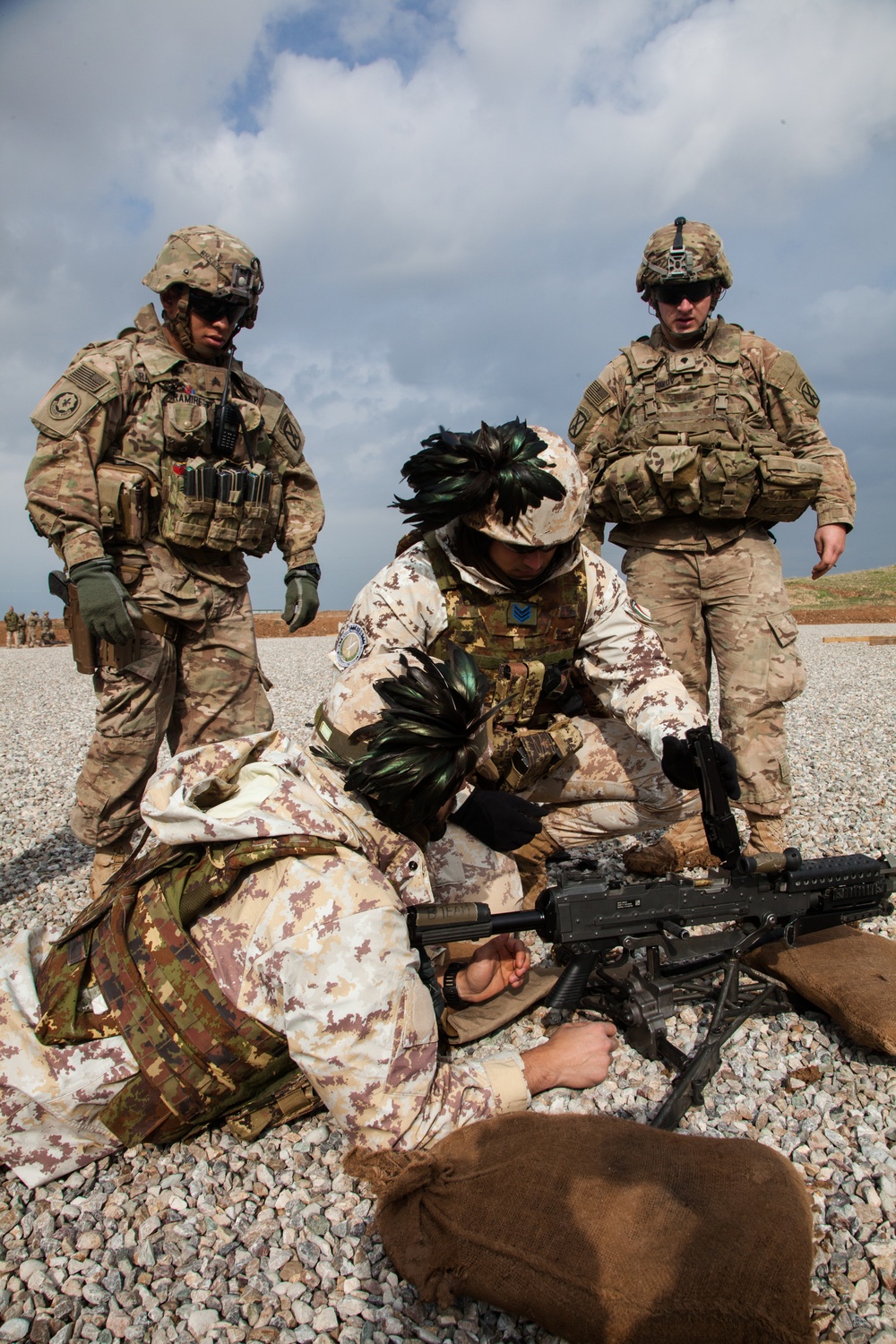 Dutch, Italian and German soldiers learn to assemble, disassemble, and operate the M240