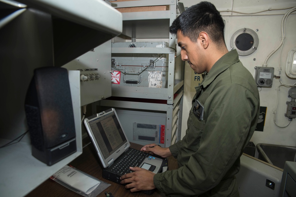 USS Bonhomme Richard sailor performs maintenance