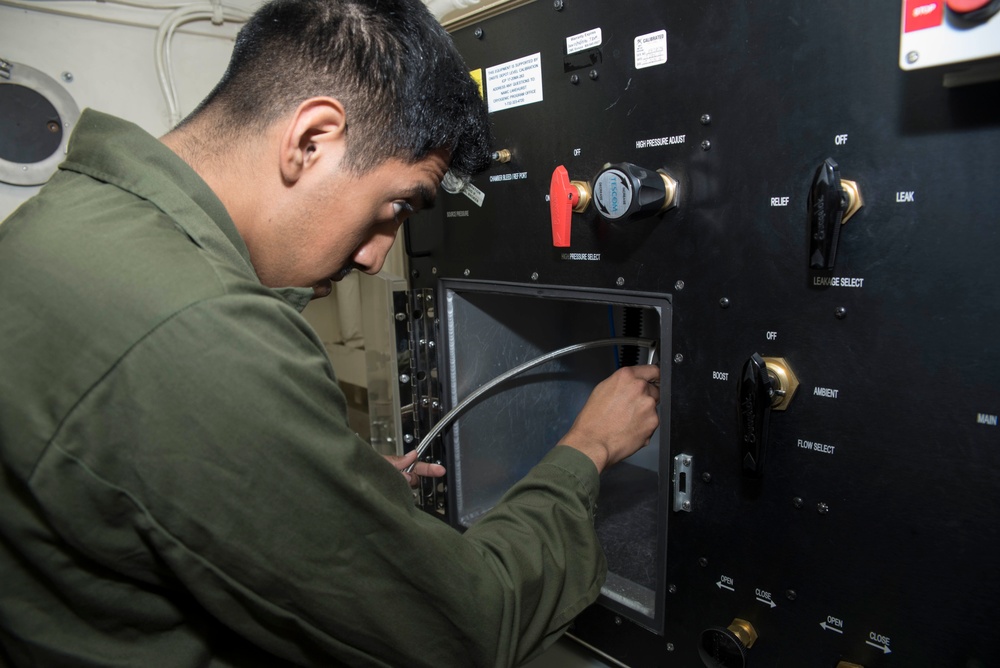 USS Bonhomme Richard sailor performs maintenance