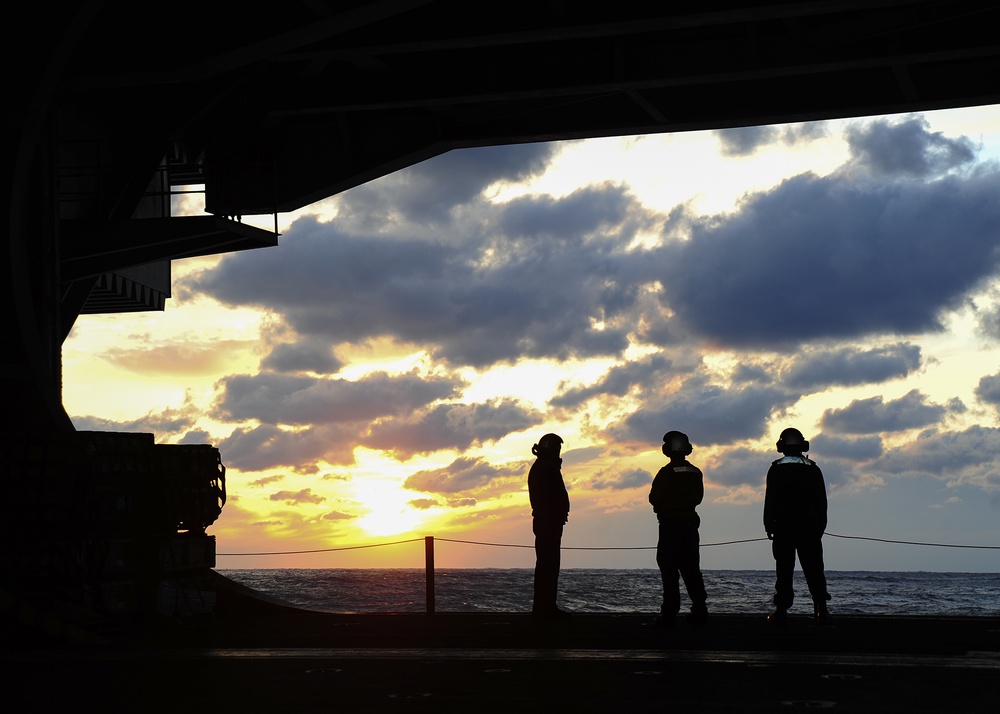 USS George Washington sailors view sunset
