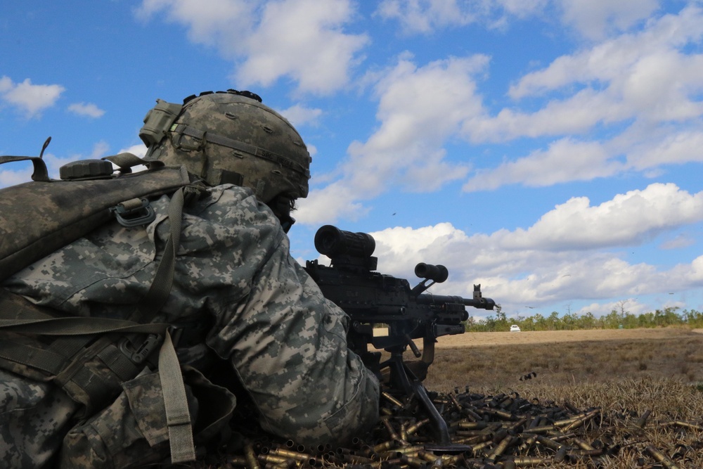 Paratrooper fires a machine gun in live-fire exercise