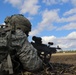 Paratrooper fires a machine gun in live-fire exercise
