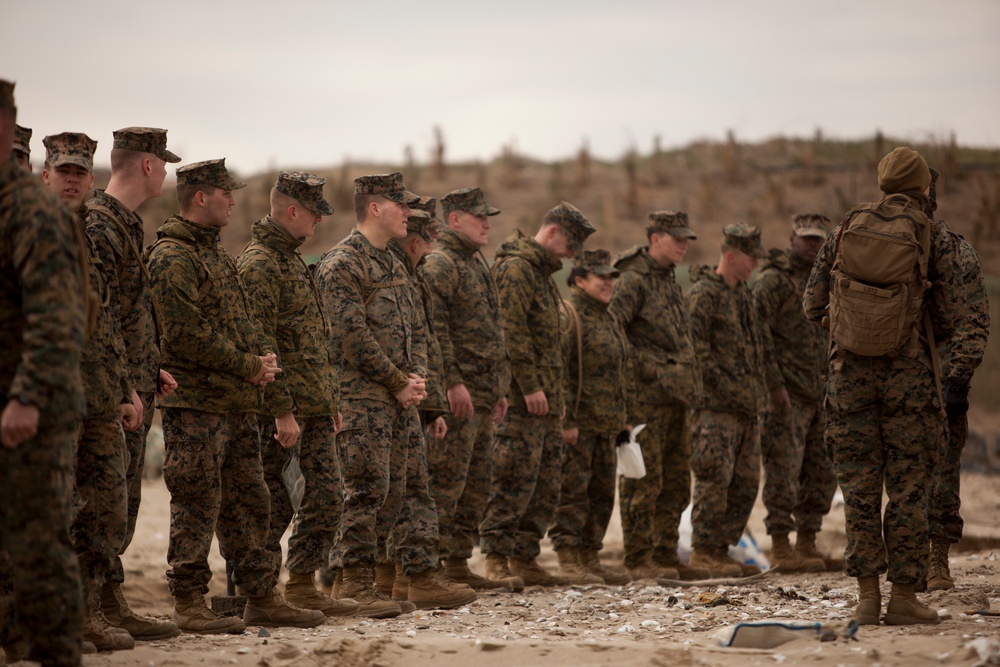 Republic of Korea and U.S. Marines clean the beach