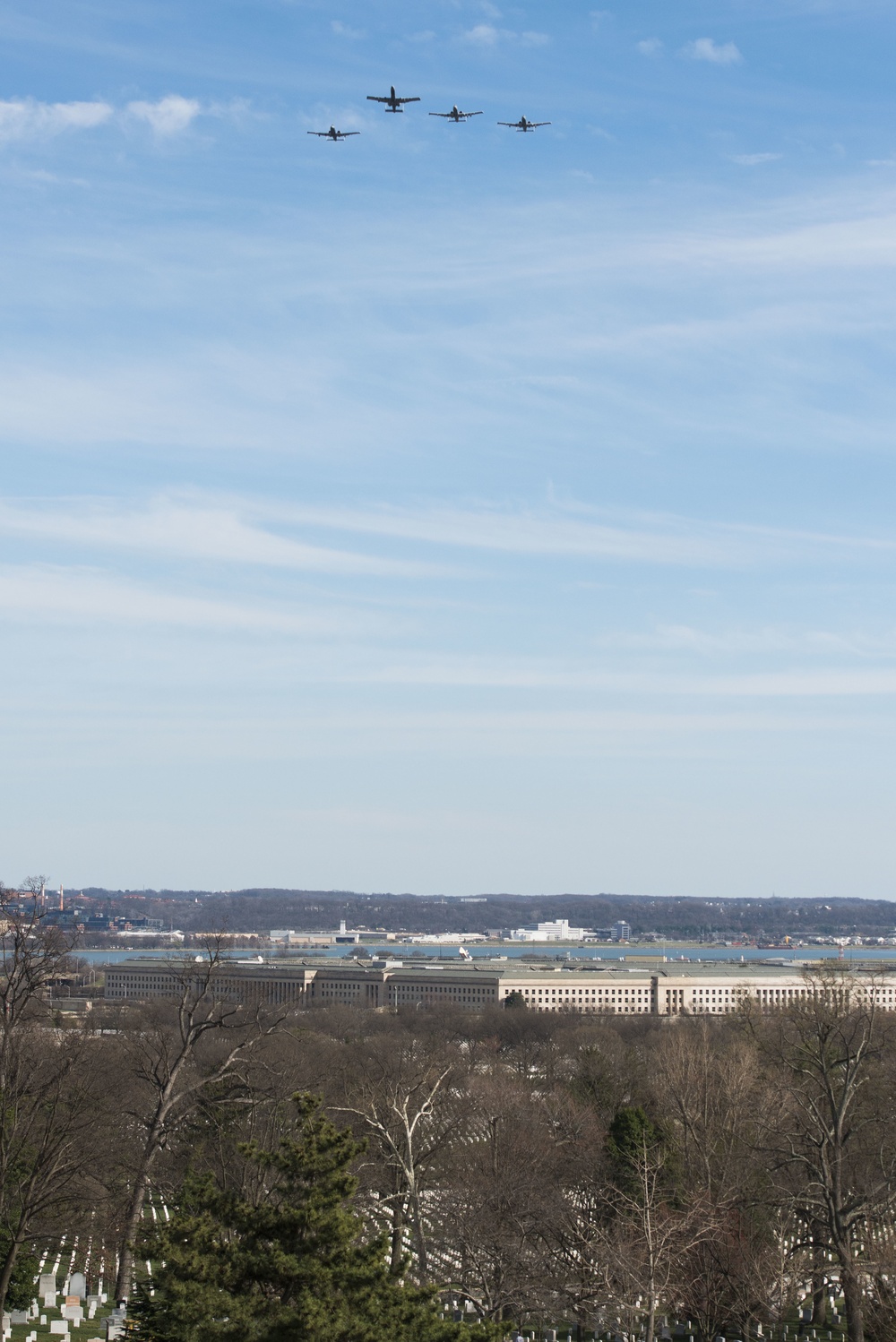 Warthog aircraft perform a Missing Man Formaiton flyover at Arlington National Cemetery