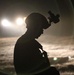Paratrooper prepares night helo landing zone
