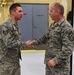 Command chief of ANG coins Airmen