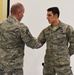Command chief of ANG coins Airmen