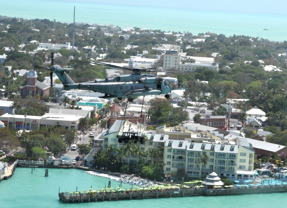 Helicopter carries Humvee