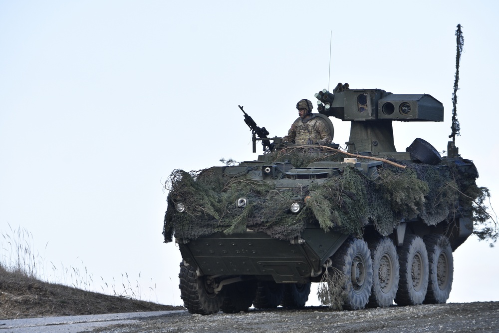 Troopers drive their M1134 anti-tank guided missile vehicle