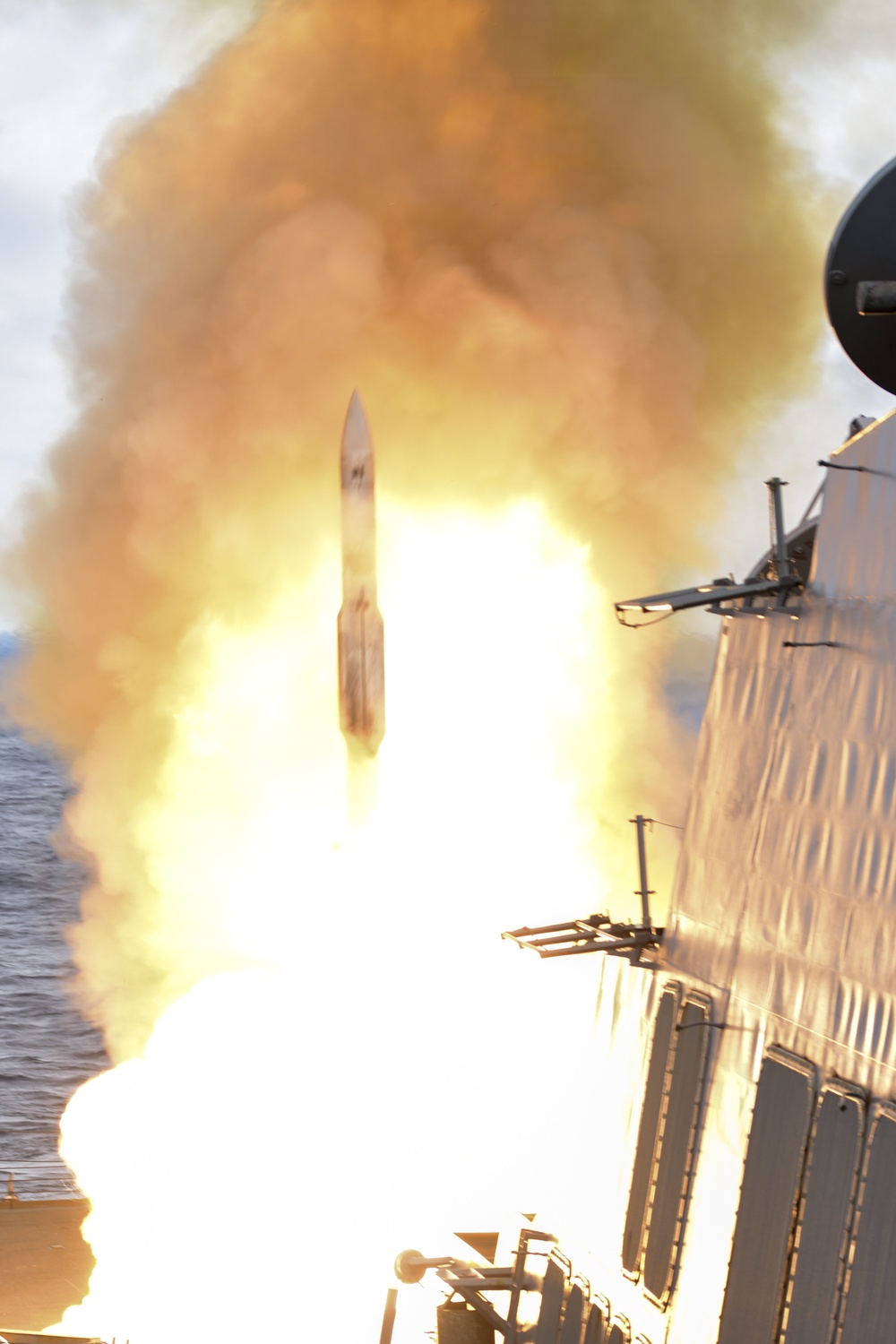 A 1,500-pound Standard Missile-2 (SM-2) leaps from guided-missile destroyer USS Roosevelt (DDG 80)