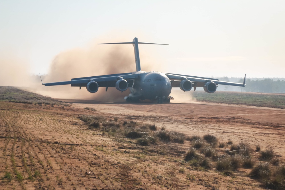 C-17 lands onto dirt strip