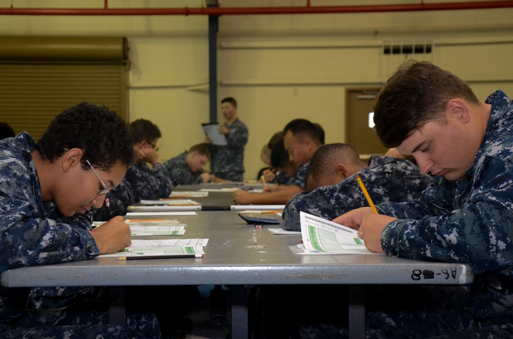 USS Frank Cable sailor takes exam