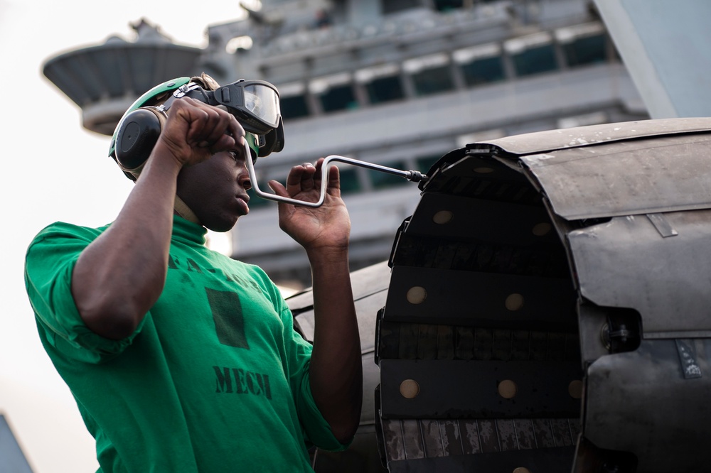 USS Harry S. Truman sailor conducts maintenance