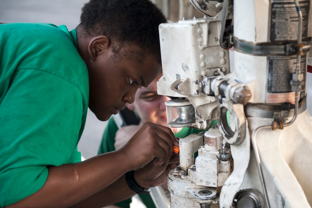 USS Harry S. Truman sailor performs maintenance