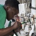 USS Harry S. Truman sailor performs maintenance