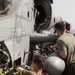 U.S. Marines with VMM 162 (REIN) wash down aircraft