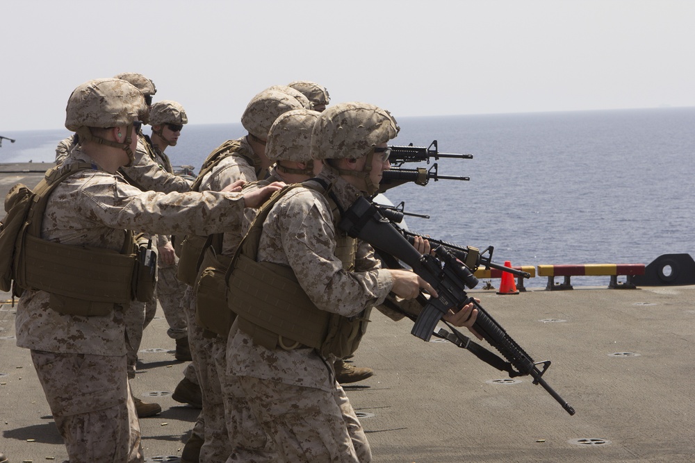 U.S. Marines assigned to the Command Element, 26th Marine Expeditionary Unit, conduct a live fire range