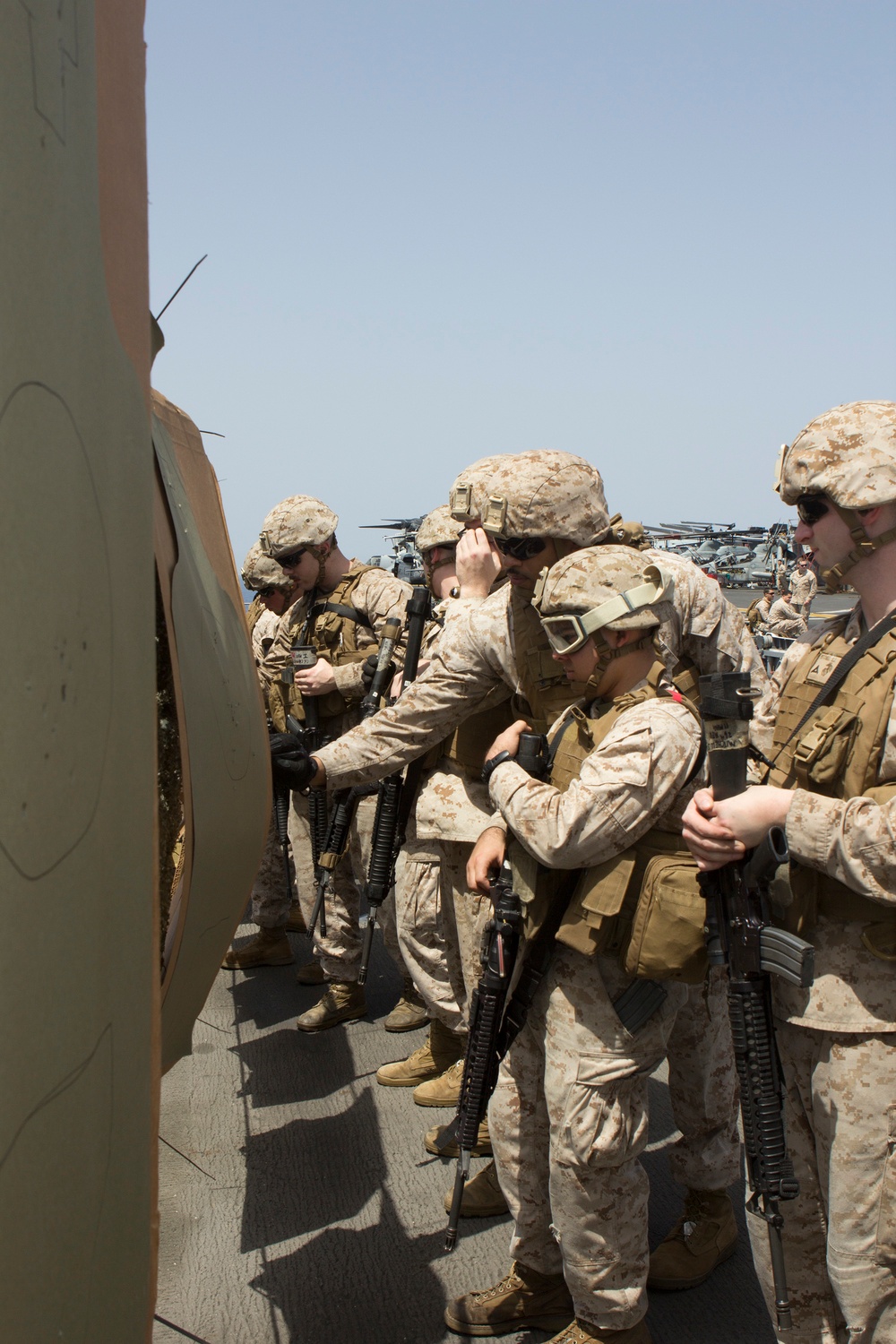 U.S. Marines assigned to the Command Element, 26th Marine Expeditionary Unit, conduct a live fire range