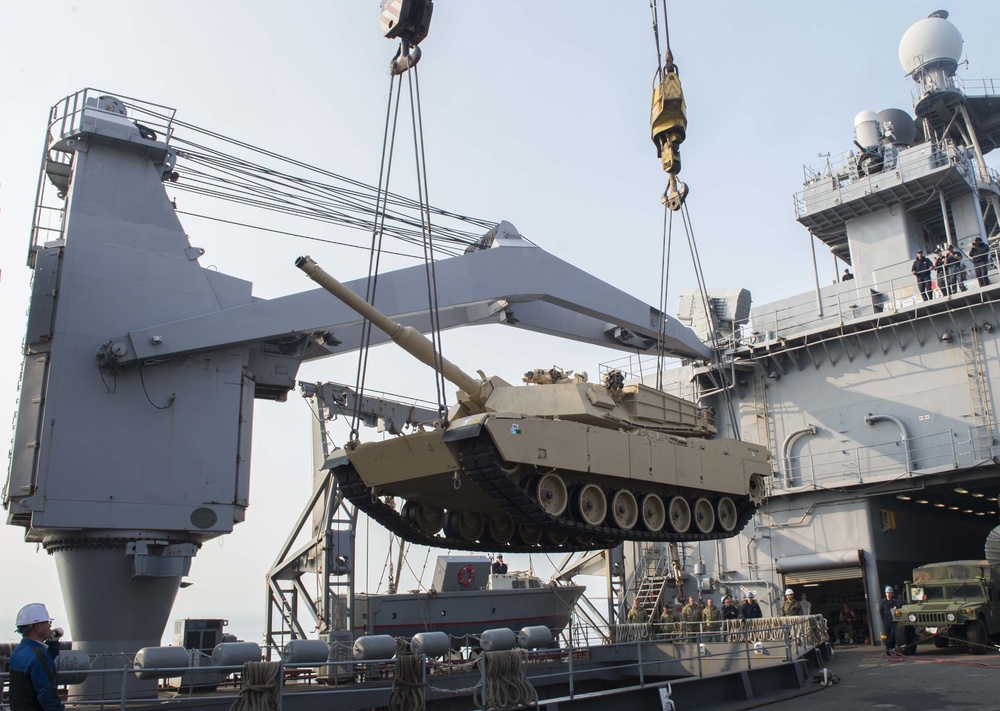 M1A1 tank on load to USS Ashland