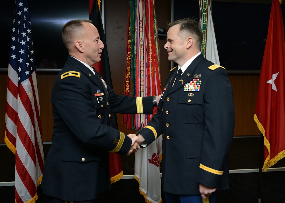 Brig. General John Hort congratulates Col. Jay Bullock