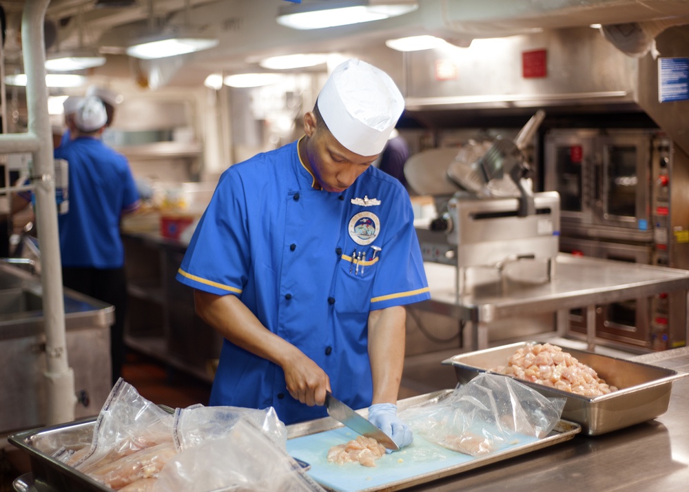 USS Blue Ridge sailors conduct food prep