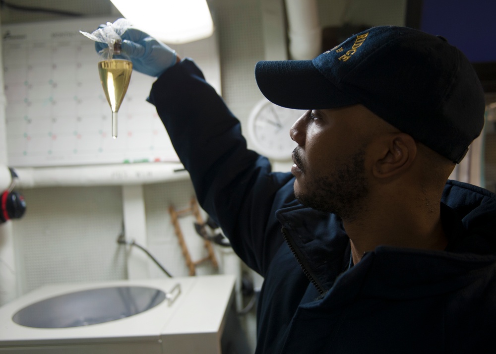 USS Blue Ridge sailor checks oil sample