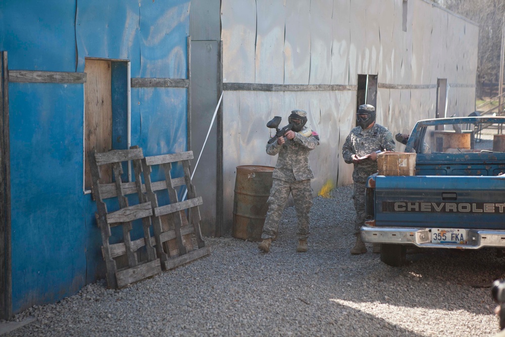 U.S. Army Soldier moves through paintball course