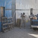 U.S. Army Soldier moves through paintball course