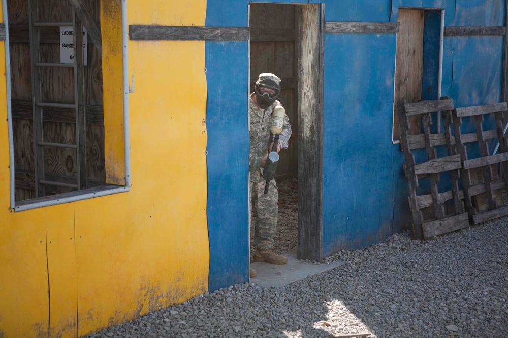 Soldier moves through paintball course