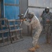 U.S. Army Soldier moves through paintball course