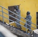 U.S. Army Soldier moves through paintball course