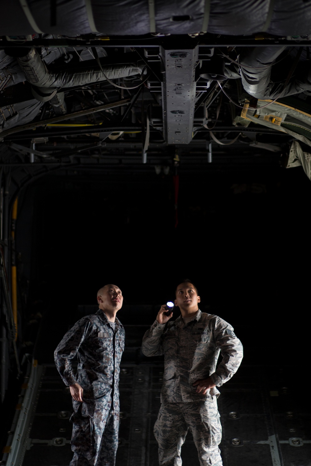 NCO exchange: JASDF airman checks a Hercules