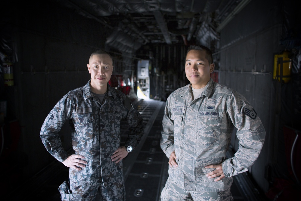 NCO exchange: JASDF airman checks a Hercules