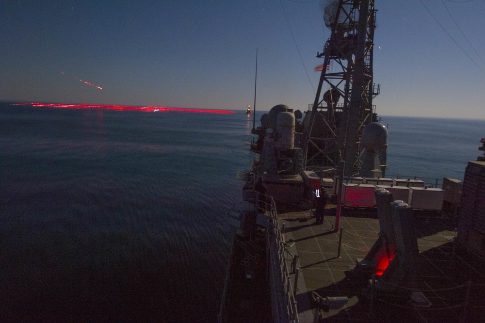 USS Stout (DDG 55) Fires a .50 caliber Machine Gun